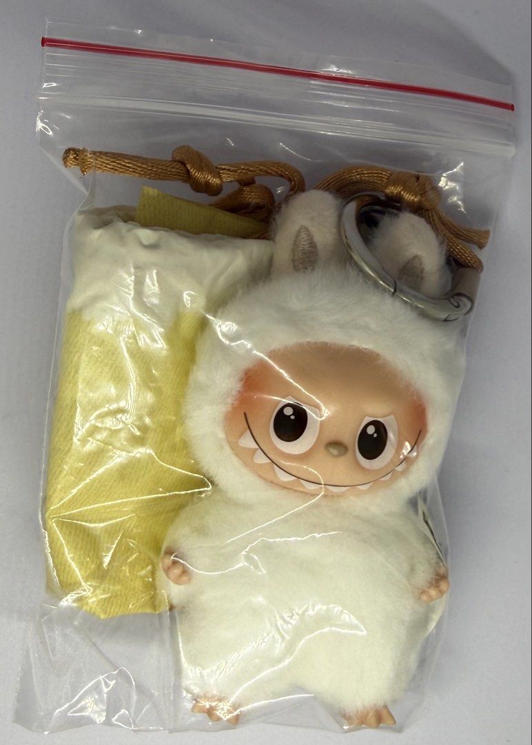Pop Mart Labubu - Pin for Love - H (Category: Plushies & Soft Toys) located in Manila. Submitted by silverfalcon_dbc769 (Listing ID 1465721919, Image 2). Description: - Authentic Pop Mart Labubu The Monsters plush keychain in white - Features a soft furry texture, signature vinyl face with mischievous teeth, and small hands/feet - Equipped with a sturdy silver keyring, brown strap, and cute cube charm - Includes original drawstring dust bag and s