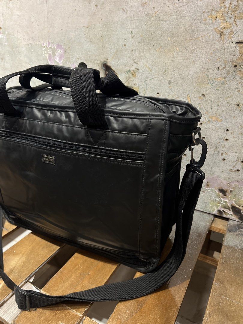 Porter Yoshida & co., 2 way laptop bag (Category: Laptop Bags & Sleeves) located in Manila. Submitted by -handpick- (Listing ID 1465672519, Image 2). Description: PORTER by Yoshida & Co., Lap top bag featuring dual top handles and an adjustable shoulder strap. Dimensions : Height : 12 inches Width : 16 inches Dept : 5.5 inches Sign of wear in good condition Issue : check last 2 pics. .