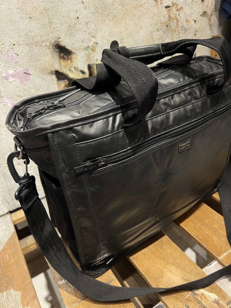 Porter Yoshida & co., 2 way laptop bag (Category: Laptop Bags & Sleeves) located in Manila. Submitted by -handpick- (Listing ID 1465672519, Image 3). Description: PORTER by Yoshida & Co., Lap top bag featuring dual top handles and an adjustable shoulder strap. Dimensions : Height : 12 inches Width : 16 inches Dept : 5.5 inches Sign of wear in good condition Issue : check last 2 pics. .