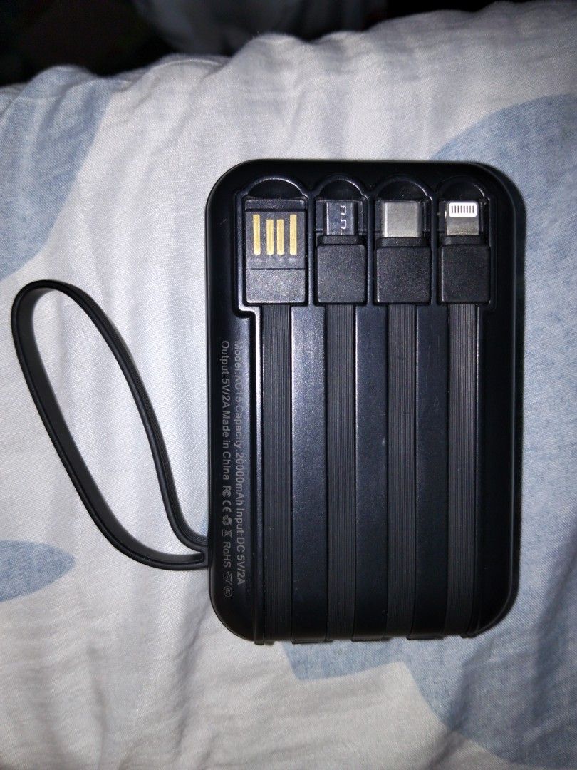 Power bank 20,000 mah (Category: Batteries & Power Banks) located in Manila. Submitted by lons28 (Listing ID 1465695550, Image 2). Description: don't really need it because it doesn't feel like 20,000mah but buy at your own risk has macro, lightning,and type c cable RFS:Low charging watt.