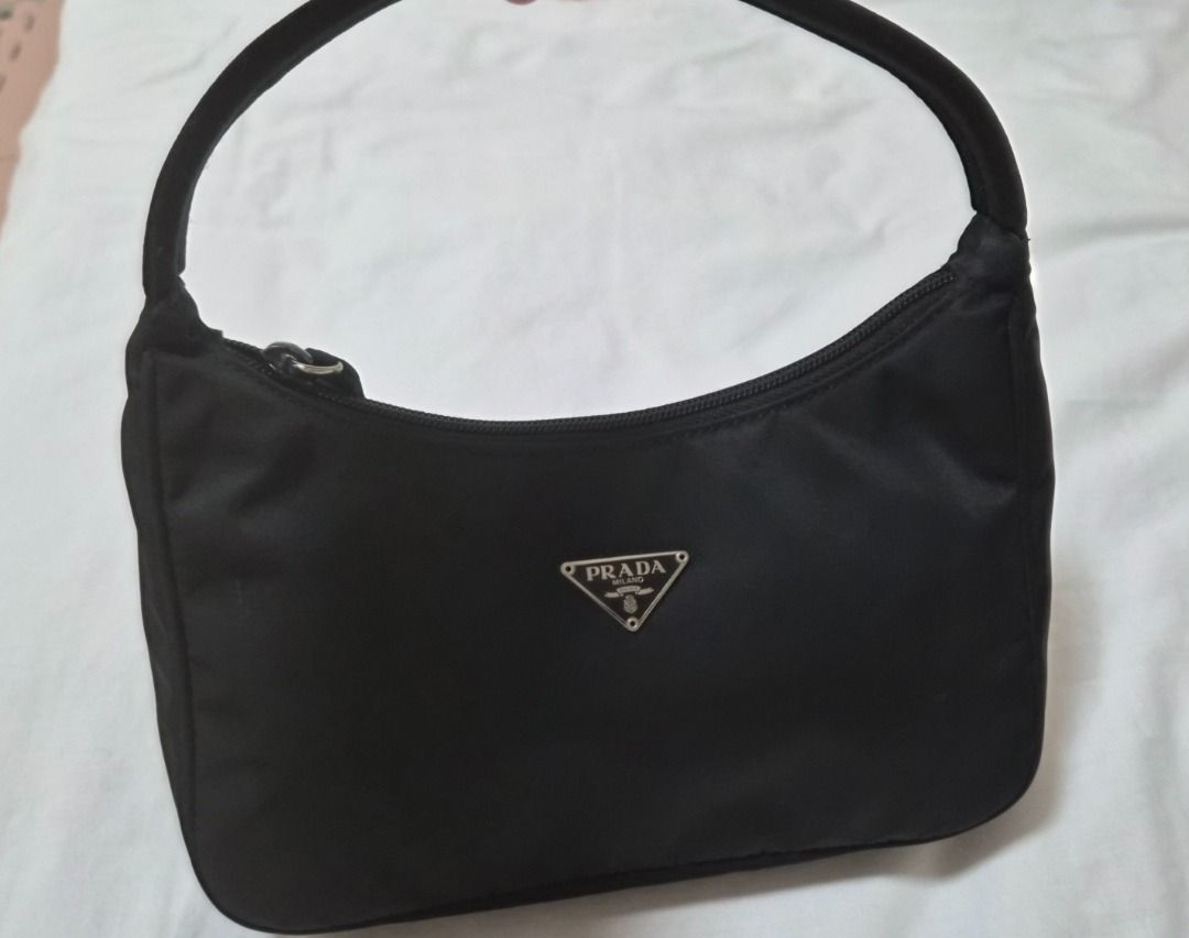 Prada Black Nylon Mini Re-Edition Shoulder Bag (Category: Luxury Bags & Wallets) located in Cavite. Submitted by yrdce (Listing ID 1465714476, Image 1). Description: Comes with Legitgrails certificate as proof of authenticity With original dustbag PM me for more detailed pics.