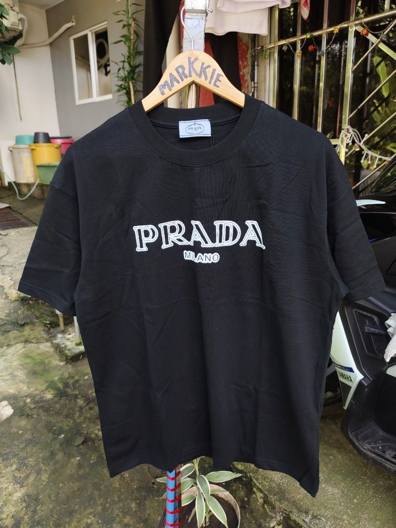 PRADA MILANO SHIRT M (Category: Luxury Apparel) located in Bulacan. Submitted by markkiethrift2023 (Listing ID 1465680216, Image 1). Description: PRADA MILANO SHIRT M BRAND NEW CONDITION DIMES: 22.5 x 28.5.