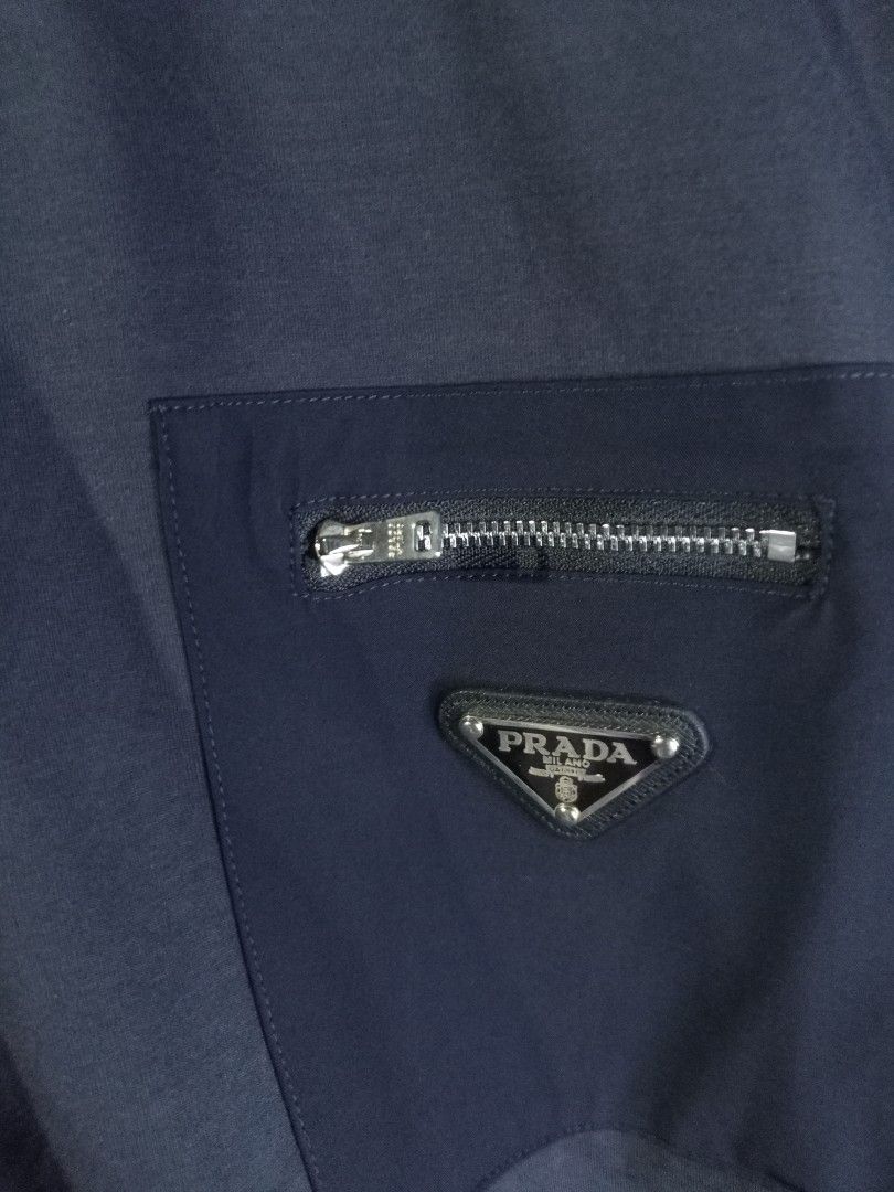 Prada Pocket Tee (Category: Tshirts & Polo Shirts ) located in Castilla. Submitted by stignapamorma (Listing ID 1465683015, Image 2). Description: Luxury Brand Pocket Tee ( Thrifted ) Size - 22x29 Condition - Excellent Color Rate - 9/10 Issue - Missing Button ( Swiped Pics For Details ) Price - 500+SF.
