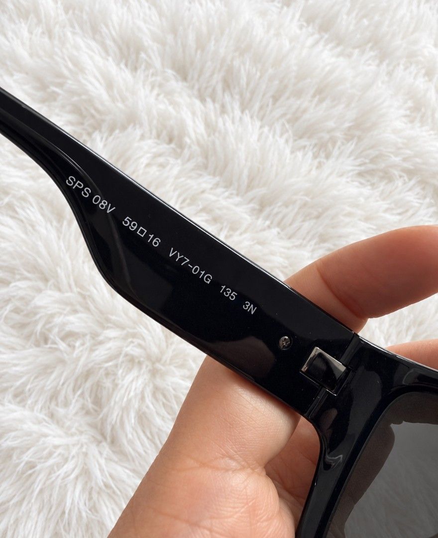 Prada SPS 08V Linea Rossa Sunglasses Black (Category: Sunglasses & Eyewear) located in Legazpi City. Submitted by rhumbalagu04057 (Listing ID 1465631679, Image 2). Description: - Brand/Model: Prada Linea Rossa SPS 08V - Color: Black with iconic red stripe on arms - Size: 59-16-135 (Bold square frames) - Condition: Clean lenses, sturdy hinges, very solid build - Inclusions: Original branded hard case, outer box, and cleaning cloth - Perfect for da
