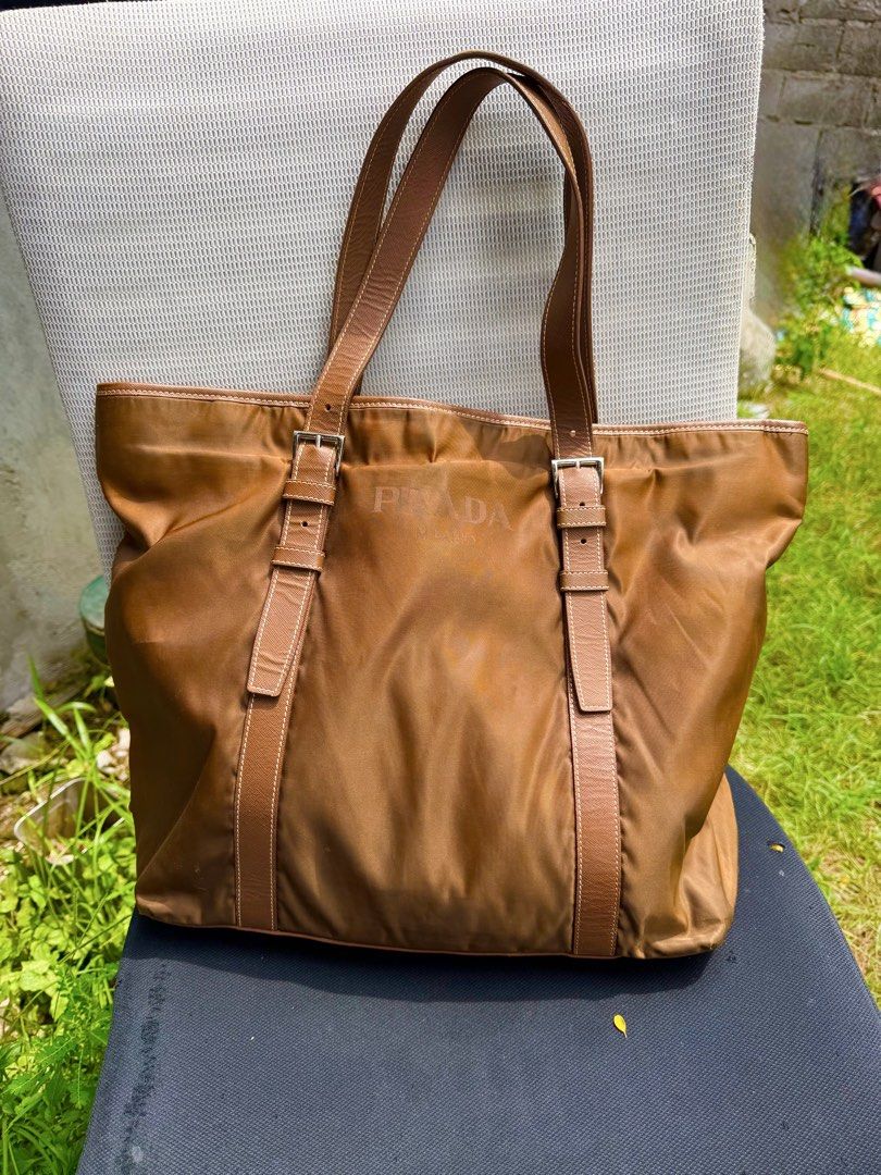Prada Tote bag Nylon tessuto large (Category: Luxury Bags & Wallets) located in Magsaysay. Submitted by goodiesthift (Listing ID 1465591479, Image 1). Description: PRADA TOTE BAG LARGE BAG BROWN COLOR RIRI ZIPPER LONG HANDLE..