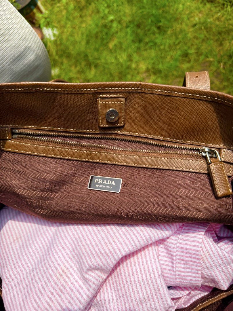 Prada Tote bag Nylon tessuto large (Category: Luxury Bags & Wallets) located in Magsaysay. Submitted by goodiesthift (Listing ID 1465591479, Image 3). Description: PRADA TOTE BAG LARGE BAG BROWN COLOR RIRI ZIPPER LONG HANDLE..