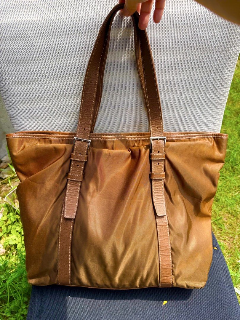 Prada Tote bag Nylon tessuto large (Category: Luxury Bags & Wallets) located in Magsaysay. Submitted by goodiesthift (Listing ID 1465591479, Image 2). Description: PRADA TOTE BAG LARGE BAG BROWN COLOR RIRI ZIPPER LONG HANDLE..