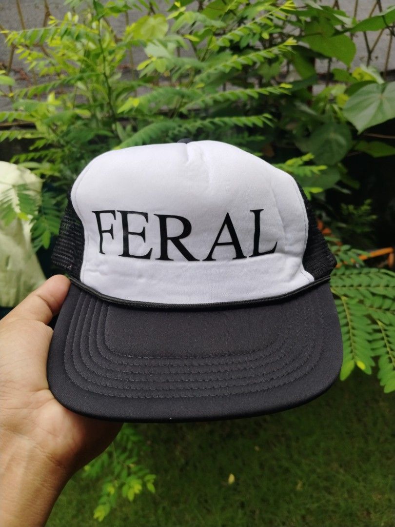 Praying Feral Trucker Hat (Category: Caps & Hats) located in Legazpi City. Submitted by genobecollectives (Listing ID 1465592328, Image 1). Description: - Brand: Praying - Style: FERAL Trucker Hat (Black & White) - Details: Bold "FERAL" print on front panel, white "Praying" embroidery on back mesh - Closure: Adjustable snapback rear - Condition: Clean all around 500 free ship.