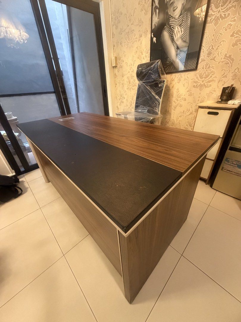 Preloved Executive Office Table (Category: Office Furniture & Fixtures) located in Paranaque City. Submitted by jackie_09542941555 (Listing ID 1465695898, Image 2). Description: I am selling my Preloved Executive Office Table Here are the dimensions: L - 1.54 meters W - 81cm H - 78cm The table is kinda heavy, needs 2 people to carry it. See photos for slight flaws on the black part of the table (doesn’t affect the performance of the office table 