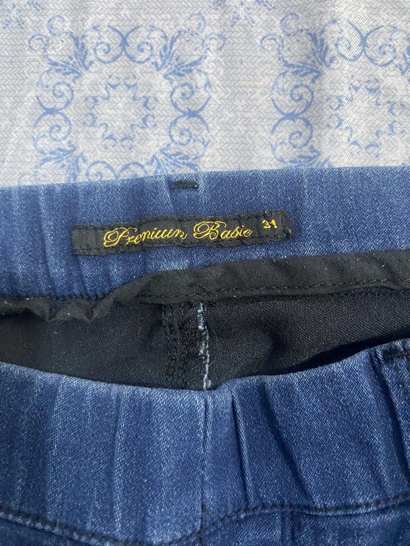 Premium Basic Denim Shorts Size 31 (Category: Shorts) located in Manila. Submitted by cjareenah (Listing ID 1465625601, Image 3). Description: - Brand: Premium Basic - Size: 31 (indicated on inner tag) - Color/Wash: Dark wash denim with stretch - Waist: Elastic waistband with belt loops - Pockets: Two front pockets, two back patch pockets - Details: Faux fly stitching, rolled cuffs at hem Mop: Gcash Mop: J&T (sf will be shouldered by buyer).