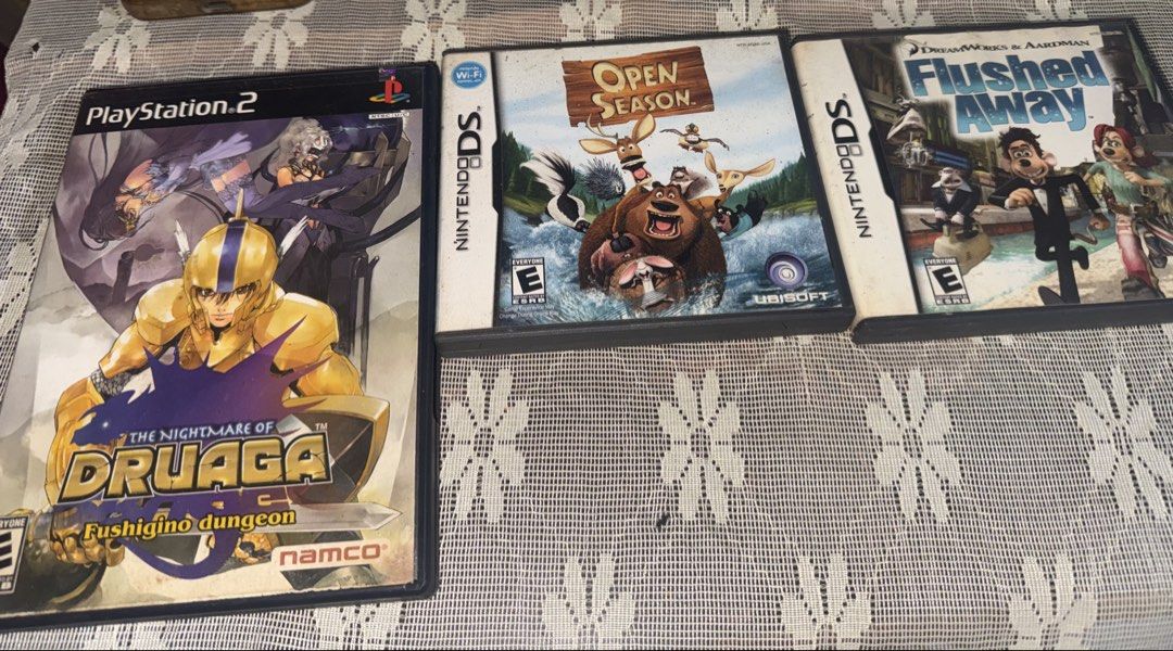 PS2 and Nintendo DS Video Games Bundle (Category: Nintendo) located in Manila. Submitted by ann.qq (Listing ID 1465584507, Image 1). Description: Bundle of three video games across PlayStation 2 and Nintendo DS platforms. Includes, - The Nightmare of Druaga Fushigino Dungeon for PS2, - Open Season - Flushed Away for Nintendo DS. Original cases and instruction booklets included for the DS titles. Discs and cartridges included as pictured. Good col