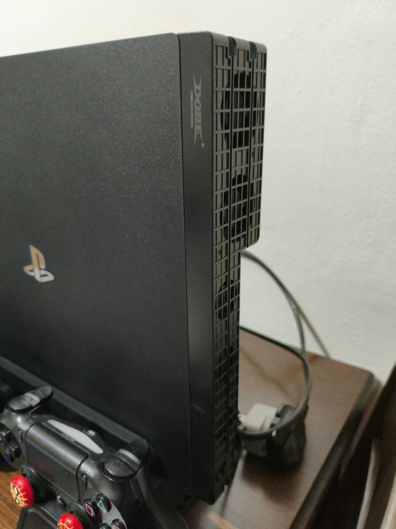 PS4 Pro 1TB (Category: PlayStation) located in Caloocan City. Submitted by zenfire.f398ed (Listing ID 1465598309, Image 3). Description: For sale PS4 Pro 1TB ✅ W/ Orig Box ✅ 2 Orig DS4 Controller ✅ 2 PS4 Games ✅ DOBE Multifunctional Cooling Stand 3 Built-in Cooling Fans Dual Controller ✅ DOBE Temperature Cooling 5 Fan ✅ No Issue Loc: Sampaloc Manila RFS: Nakatambak, bihira gamitin busy sa work at nagaalaga ng baby .