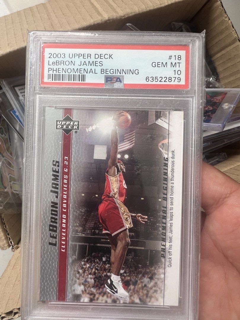 LeBron James 18 (Category: Graded Singles) located in Cagayan de Oro. Submitted by janreil12 (Listing ID 1465758518, Image 1). Description: LeBron James 2003 Upper Deck Phenomenal Beginning #18 RC — PSA 10 Gem Mint ₱14,500 negotiable PSA 10 • 2003 Upper Deck • Rookie Card CDO meetup / shipping available.