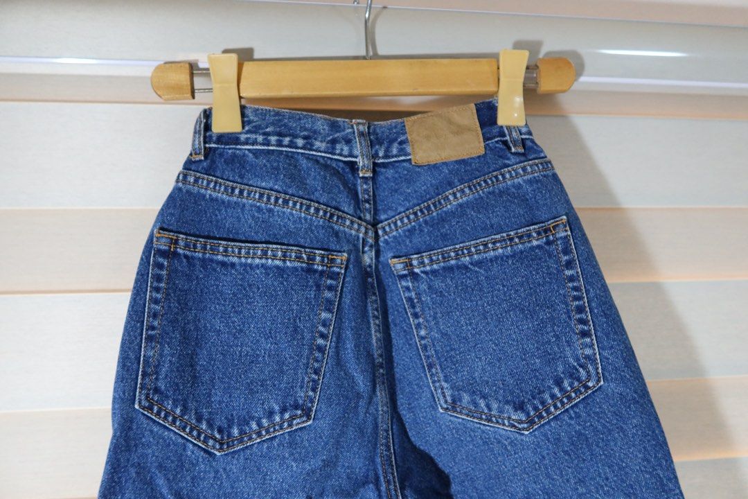 Pull&Bear High-Waist Denim Jeans (Category: Jeans) located in Cabanatuan. Submitted by jstne_ (Listing ID 1465610512, Image 3). Description: ₱600 Each ₱1000 for 2pcs - Brand: Pull&Bear - Style: High-waisted straight leg denim jeans - Color: Classic dark blue wash with stylish contrast stitching - Details: Button fly closure, functional front and back pockets, and leather patch on the back waistband - Fit: Flattering, versatile wardrobe staple per