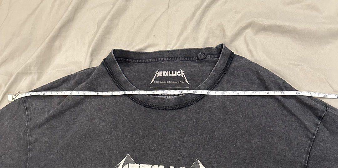Pull&Bear Metallica Acid Wash T-Shirt (Category: Tshirts & Polo Shirts ) located in Cainta. Submitted by calcervshop (Listing ID 1465745535, Image 3). Description: DIMES: - Shoulder: 22 inches - Length: 29.5 inches - Brand: Pull&Bear x Metallica - Color/Wash: Dark grey acid wash (vintage, worn-in look) - Size: Large (relaxed fit) - Design: Classic Metallica band logo centered on chest - Details: Crew neck, branded inner neck tag - Condition: Exce