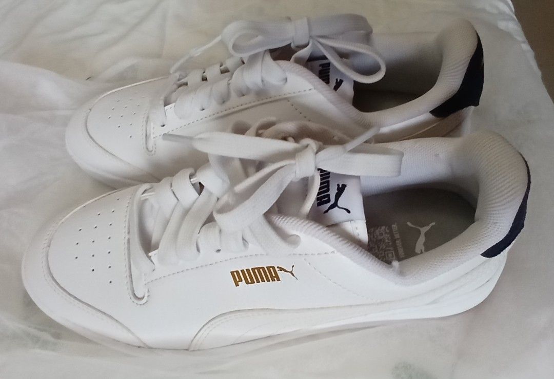 Puma Shuffle Trainers White Sneakers (Category: Sneakers) located in Taytay. Submitted by marlonbeech (Listing ID 1465608153, Image 1). Description: - Brand/Model: Classic White Puma Shuffle Trainers Sneakers - Condition: Brandnew-no box, Comfortable daily shoes with minor scuffs and light wear on the inside collar - Features: Clean white laces, insole with Puma jumping cat logo and QR code print - Longevity: Still has plenty of life left for eve