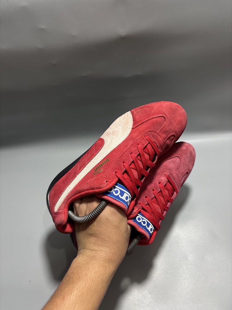 Puma Sparco Red Suede Sneakers Size US 8 (Category: Sneakers) located in Butuan. Submitted by shoeetasho (Listing ID 1465757249, Image 2). Description: - Brand: Puma x Sparco - Style: Motorsport sneakers / Driving shoes - Color: Red suede with white formstrip, blue tongue branding, and gold Puma cat logo - Size: US 8 / EUR 40.5 / 26cm - Condition: Clean uppers with solid rubber outsoles - Fit: Comfortable low-profile design ideal for driving or s