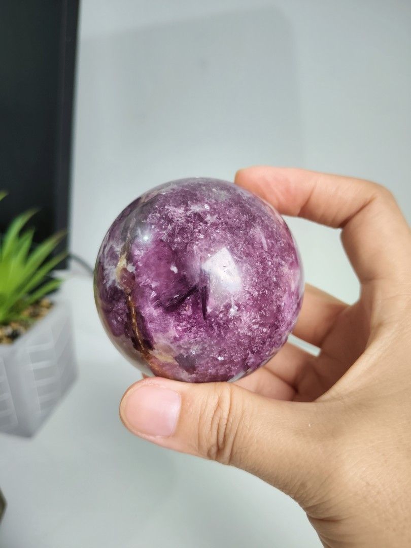 Purple Mica Crystal Sphere (Category: Precious Stones) located in Cavite. Submitted by lynlcb (Listing ID 1465653079, Image 2). Description: - Stunning round polished crystal sphere in mesmerizing shades of purple and deep violet - Features unique natural patterns and visible crystalline formations throughout - Smooth, glossy surface finish that catches the light beautifully - Perfectly sized to fit nicely in the palm of your hand - Ideal for des