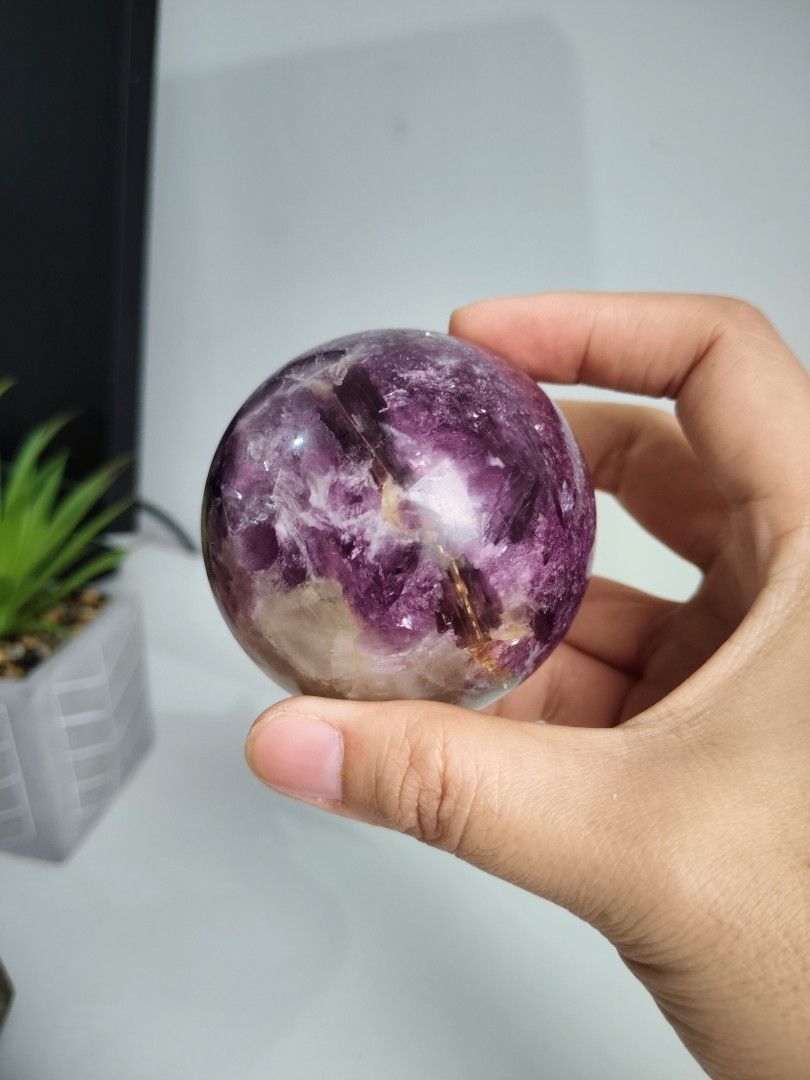 Purple Mica Crystal Sphere (Category: Precious Stones) located in Cavite. Submitted by lynlcb (Listing ID 1465653079, Image 1). Description: - Stunning round polished crystal sphere in mesmerizing shades of purple and deep violet - Features unique natural patterns and visible crystalline formations throughout - Smooth, glossy surface finish that catches the light beautifully - Perfectly sized to fit nicely in the palm of your hand - Ideal for des