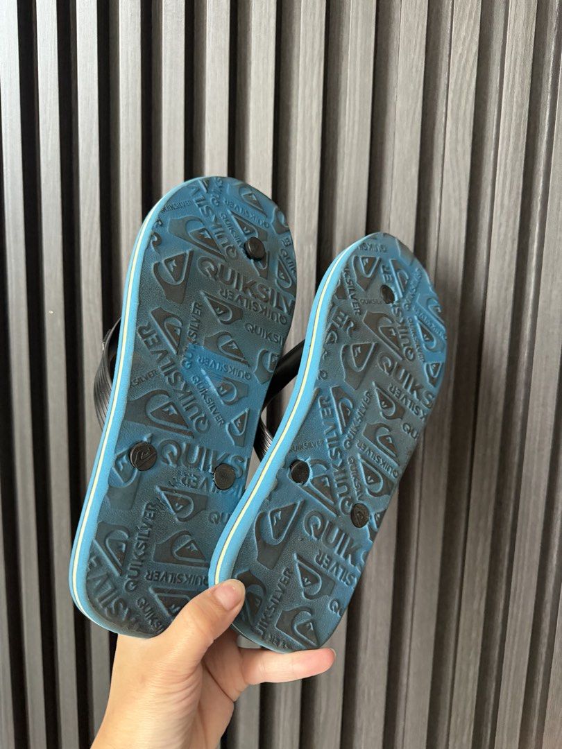 Quiksilver Blue Striped Flip-Flops Sandals (Category: Slippers & Slides) located in Manila. Submitted by purestar.01 (Listing ID 1465586819, Image 3). Description: - Brand: Quiksilver - Color: Blue with striped footbed and black straps - Features: Lightweight design, white Quiksilver strap branding, and textured grip soles - Condition: Clean with minimal wear - Best for: Beach trips, poolside, or casual everyday lounging.