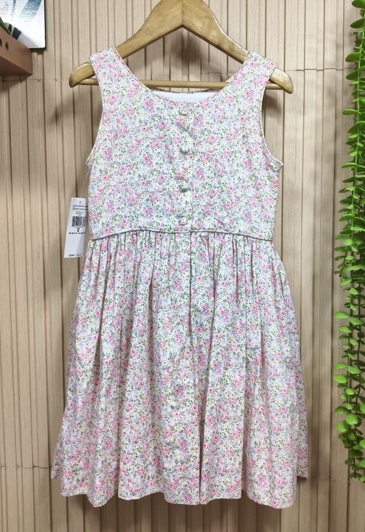 Ralph Lauren Floral Dress (Category: Babies & Kids Fashion) located in Quezon City. Submitted by christinejoycheng1 (Listing ID 1465736596, Image 2). Description: - Brand: Ralph Lauren - Condition: Brand new with original store tags attached - Design: Pink floral print, sleeveless, fitted bodice, and flared skirt - Details: Back button closure, complete with white inner lining - Material: 100% premium cotton (lightweight and breathable) - Style: 