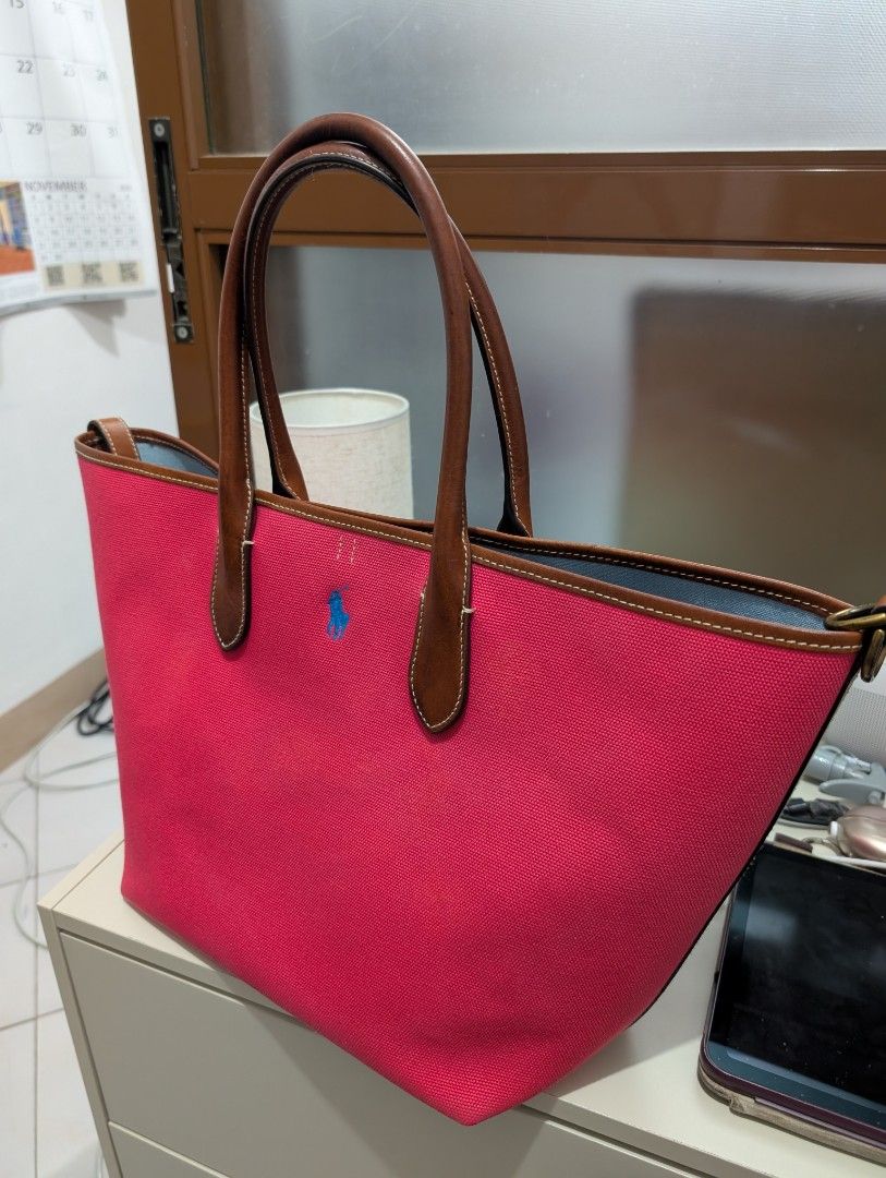 Ralph Lauren Medium Bellport Tote (Category: Tote Bags) located in Las Pinas. Submitted by janatew (Listing ID 1465720312, Image 2). Description: Ralph Lauren Medium Bellport Tote. Brown leather shoulder handles and trim. Blue embroidered logo on the front. Light blue interior. Spacious open top design. Roomy everyday carryall. Reversible RFS: Too many bags.