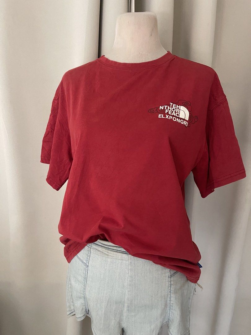 Red Graphic T-Shirt Short Sleeve (Category: Shirts) located in Cainta. Submitted by zlove111 (Listing ID 1465584097, Image 3). Description: - Color: Vibrant Red - Fit: Relaxed and comfortable - Design: Eye-catching graphic prints and stylized text logo on front and back - Material: Soft, breathable cotton fabric - Neckline: Standard crew neck - Styling: Perfect for pairing with denim shorts or jeans boxy up to xl .