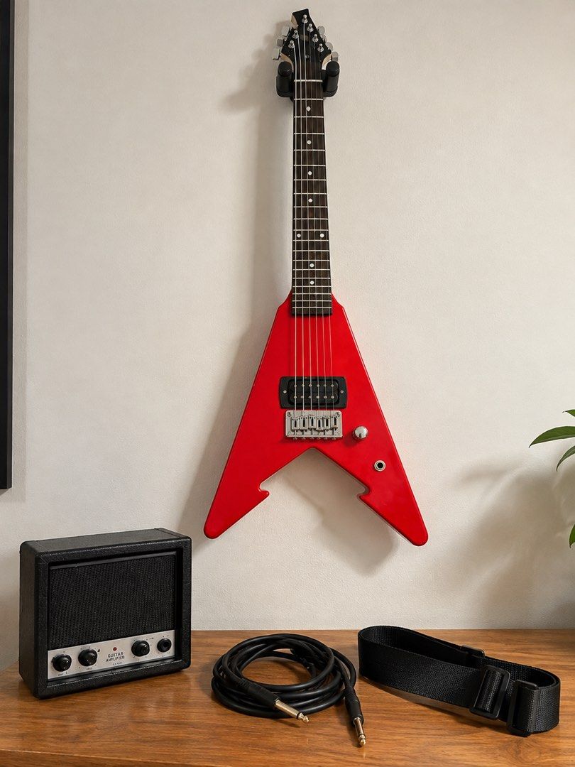 Red Junior V Electric Guitar Starter Set With Amp (Category: Musical Instruments) located in Manila. Submitted by espcc (Listing ID 1465631445, Image 2). Description: 🎸 RED JUNIOR ELECTRIC GUITAR + MINI AMP SET — GOOD CONDITION Selling our son’s electric guitar set! ❤️🎸 Used but still in good condition and fully functional. Our 15-year-old son has simply outgrown the guitar, so we’re letting it go to someone who can enjoy it more. INCLUDED: 🎸 