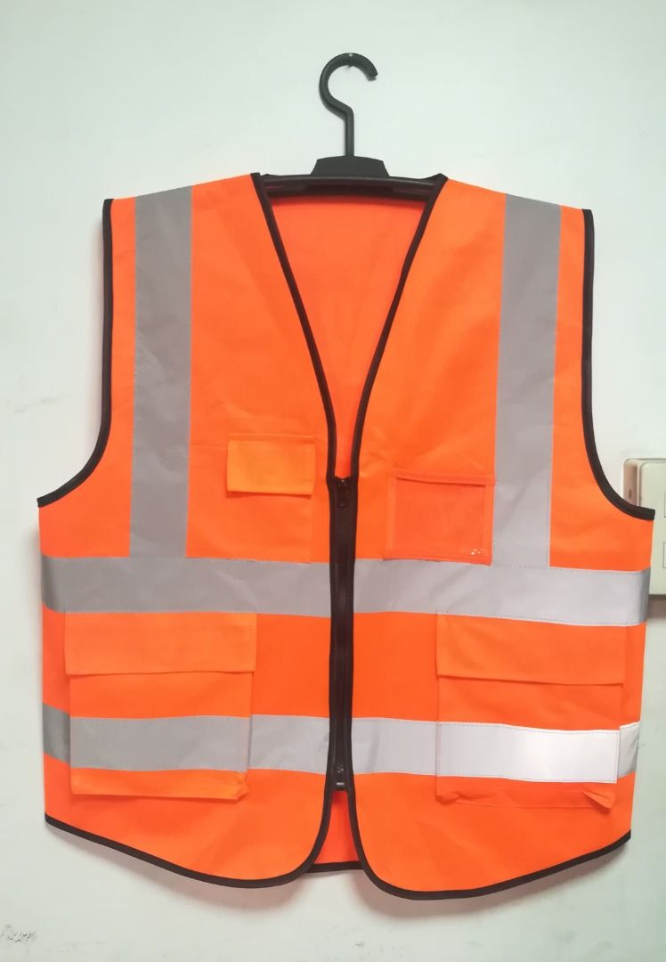 Reflectorized Safety Vest Neon Orange with Pocket (Category: Vests) located in Manila. Submitted by toplen (Listing ID 1465633756, Image 1). Description: Color: Neon Orange Free size Size: 26" length x 22" width With gray reflective (2 inches) With two pockets The vest can play a strong warning, especially in dark conditions issued more eye-catching signs, for security Suitable For: Night riding, Is mainly plays the role of warning. High Visibili