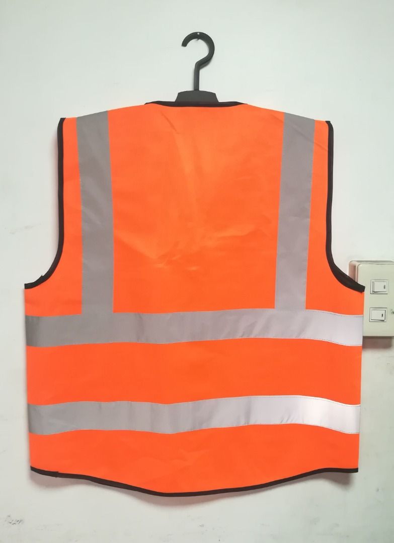 Reflectorized Safety Vest Neon Orange with Pocket (Category: Vests) located in Manila. Submitted by toplen (Listing ID 1465633756, Image 2). Description: Color: Neon Orange Free size Size: 26" length x 22" width With gray reflective (2 inches) With two pockets The vest can play a strong warning, especially in dark conditions issued more eye-catching signs, for security Suitable For: Night riding, Is mainly plays the role of warning. High Visibili