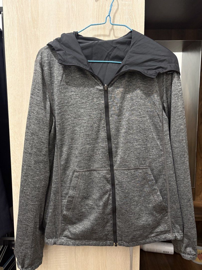 Reversible Black and Grey Hooded Jacket (Category: Coats, Jackets and Outerwear) located in Pasig City. Submitted by munchinitajanella (Listing ID 1465616922, Image 3). Description: Versatile reversible jacket with a smooth black outer shell and a soft grey marled fabric lining. Includes a full zip front, attached hood, and front pockets. Wear it either way depending on the weather or outfit. Great layering piece for breezy days, workouts, or cas