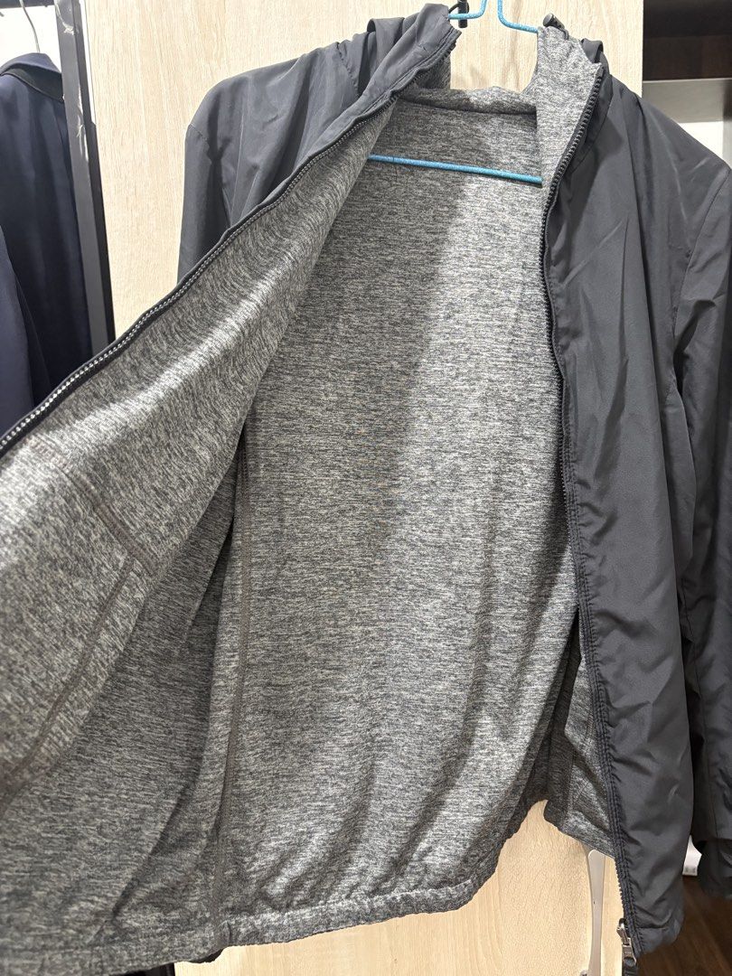 Reversible Black and Grey Hooded Jacket (Category: Coats, Jackets and Outerwear) located in Pasig City. Submitted by munchinitajanella (Listing ID 1465616922, Image 2). Description: Versatile reversible jacket with a smooth black outer shell and a soft grey marled fabric lining. Includes a full zip front, attached hood, and front pockets. Wear it either way depending on the weather or outfit. Great layering piece for breezy days, workouts, or cas