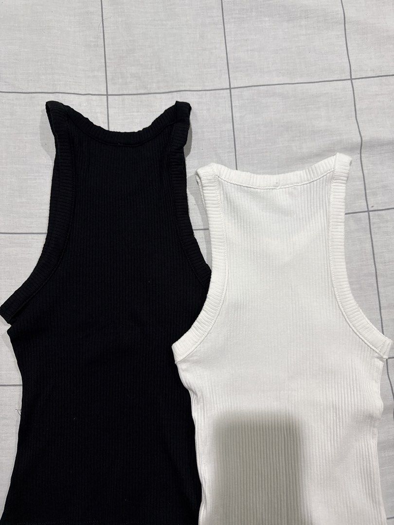 Ribbed Tank Tops Bundle Black and White (Category: Sleeveless) located in Taytay. Submitted by chichays (Listing ID 1465583046, Image 3). Description: - Set of 2 ribbed tank tops (Black and White) full length - Size: XS (Tag: 155/80A) perfect for xs girlies - Fit: Fitted cut with a chic high neckline - Material: Stretchy and comfortable fabric - Condition: Great basic wardrobe staples - Selling as a set.