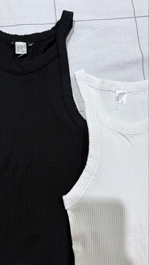 Ribbed Tank Tops Bundle Black and White (Category: Sleeveless) located in Taytay. Submitted by chichays (Listing ID 1465583046, Image 2). Description: - Set of 2 ribbed tank tops (Black and White) full length - Size: XS (Tag: 155/80A) perfect for xs girlies - Fit: Fitted cut with a chic high neckline - Material: Stretchy and comfortable fabric - Condition: Great basic wardrobe staples - Selling as a set.