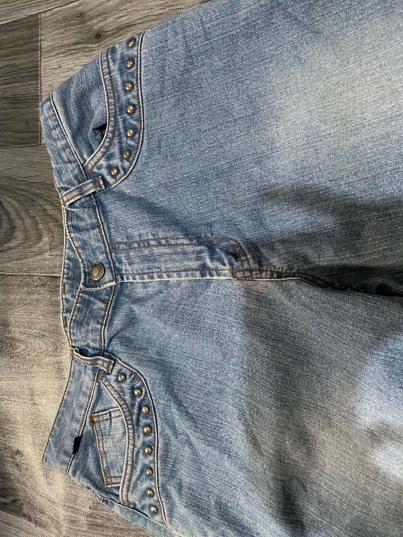 Rike Jean Studded Denim Jeans (Category: Jeans) located in Cagayan de Oro. Submitted by rhyrhyrhys (Listing ID 1465611825, Image 3). Description: - Brand: Rike Jean - Wash: Light wash - Fit: Straight leg - Details: Silver studs on front and back pockets, brown leather 'Rike Jeans Division' patch on the back waistband - Closure: Zip fly with button DIMES: L - 36.5 W - 30 HEM - 10 INSEAM - 27 F. RISE - 9.5 B. RISE - 12.5.