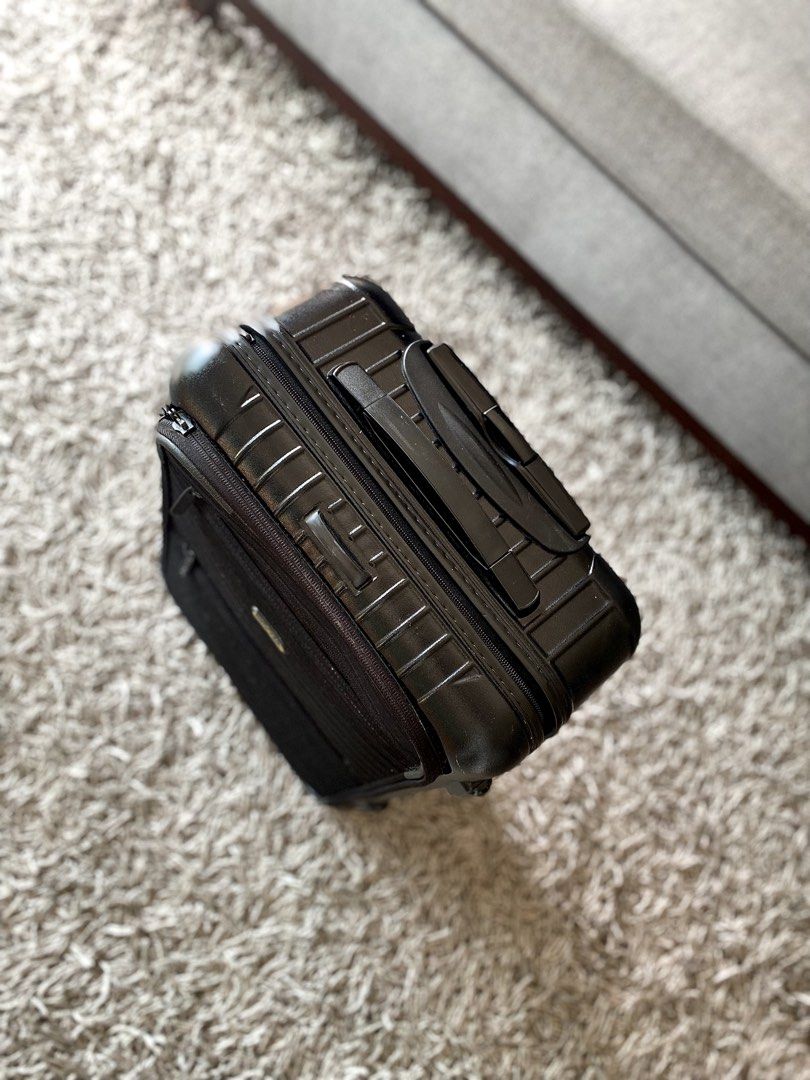 Rimowa Black Hand-carry Suitcase (Category: Luggage) located in Makati City. Submitted by lucid_soul (Listing ID 1465662686, Image 2). Description: - Rimowa Essential Hand Carry - Sturdy polycarbonate and durable build ideal for frequent travelers - Smooth-rolling wheels and retractable handle for easy mobility - Convenient outer pockets for easy laptop access at airports and secure combination lock - Signature Rimowa branded fabric interior lini