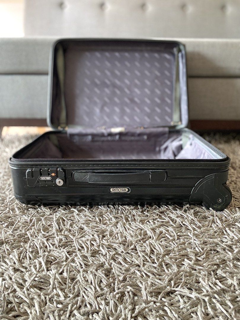 Rimowa Black Hand-carry Suitcase (Category: Luggage) located in Makati City. Submitted by lucid_soul (Listing ID 1465662686, Image 3). Description: - Rimowa Essential Hand Carry - Sturdy polycarbonate and durable build ideal for frequent travelers - Smooth-rolling wheels and retractable handle for easy mobility - Convenient outer pockets for easy laptop access at airports and secure combination lock - Signature Rimowa branded fabric interior lini