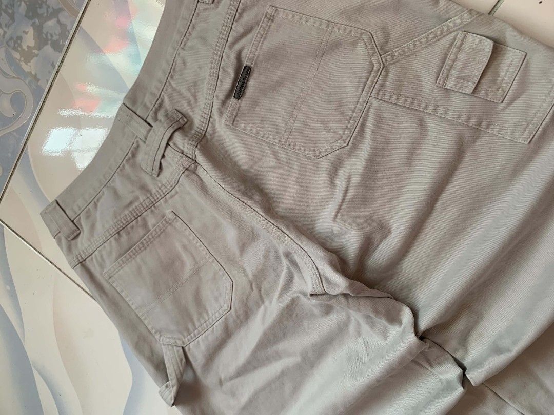 Riveted By Lee Carpenter Shorts Beige (Category: Shorts) located in Calamba. Submitted by glennkun192535 (Listing ID 1465627988, Image 3). Description: - Brand: Riveted By Lee - Color: Beige - Style: Classic carpenter utility shorts - Material: Heavy-duty cotton twill fabric - Features: Multiple pockets, hammer loop detail, branded button closure, and back pocket woven label - Fit/Occasion: Great streetwear staple for warm weather.