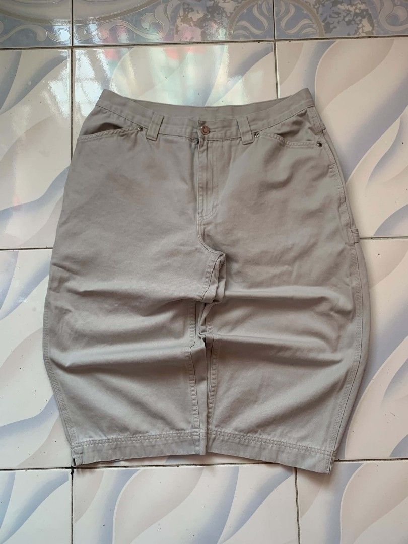 Riveted By Lee Carpenter Shorts Beige (Category: Shorts) located in Calamba. Submitted by glennkun192535 (Listing ID 1465627988, Image 1). Description: - Brand: Riveted By Lee - Color: Beige - Style: Classic carpenter utility shorts - Material: Heavy-duty cotton twill fabric - Features: Multiple pockets, hammer loop detail, branded button closure, and back pocket woven label - Fit/Occasion: Great streetwear staple for warm weather.