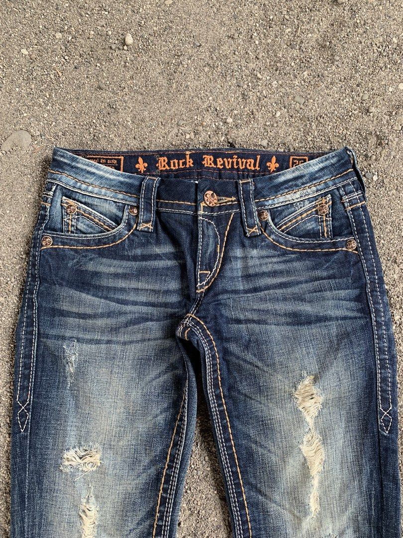 Rock rivival (Category: Jeans) located in Tacurong. Submitted by ljsthrift (Listing ID 1465633145, Image 3). Description: - Brand: Rock Revival - Style: Distressed flare leg denim jeans - Features: Signature embroidered back pockets with flap buttons, contrast stitching, and front distressing - Color: Medium to dark wash blue - Condition: Pre-loved, well-maintained -size 28-29.