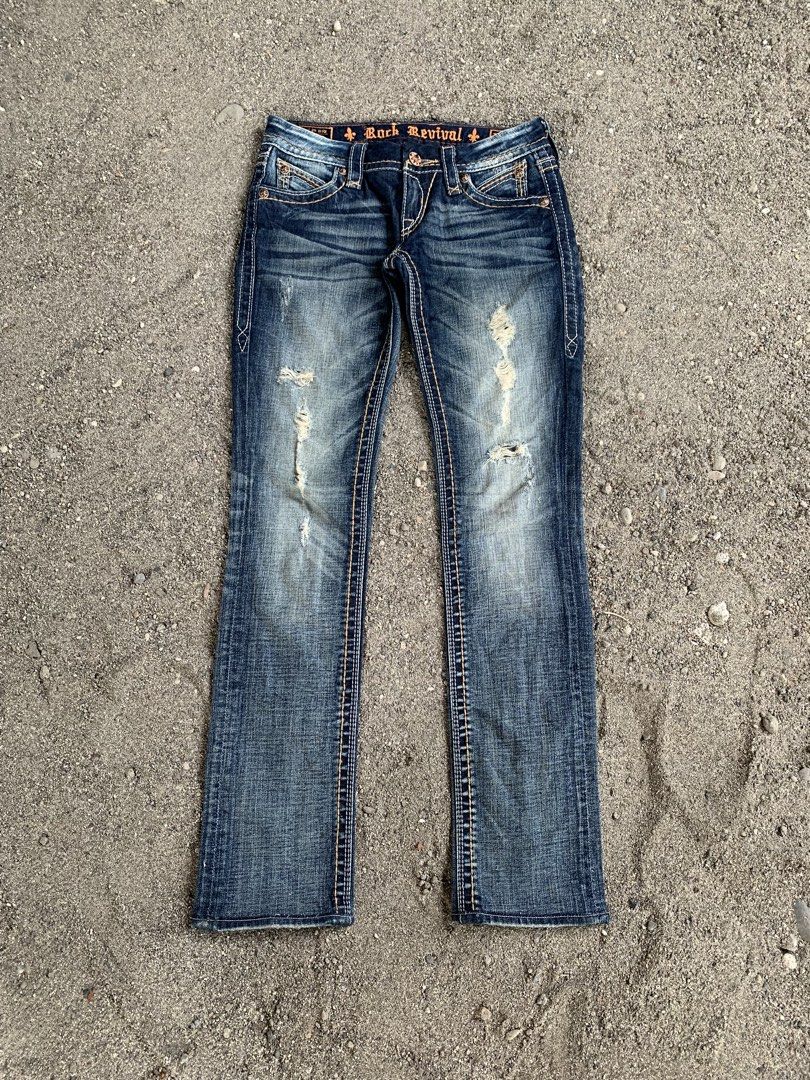 Rock rivival (Category: Jeans) located in Tacurong. Submitted by ljsthrift (Listing ID 1465633145, Image 2). Description: - Brand: Rock Revival - Style: Distressed flare leg denim jeans - Features: Signature embroidered back pockets with flap buttons, contrast stitching, and front distressing - Color: Medium to dark wash blue - Condition: Pre-loved, well-maintained -size 28-29.
