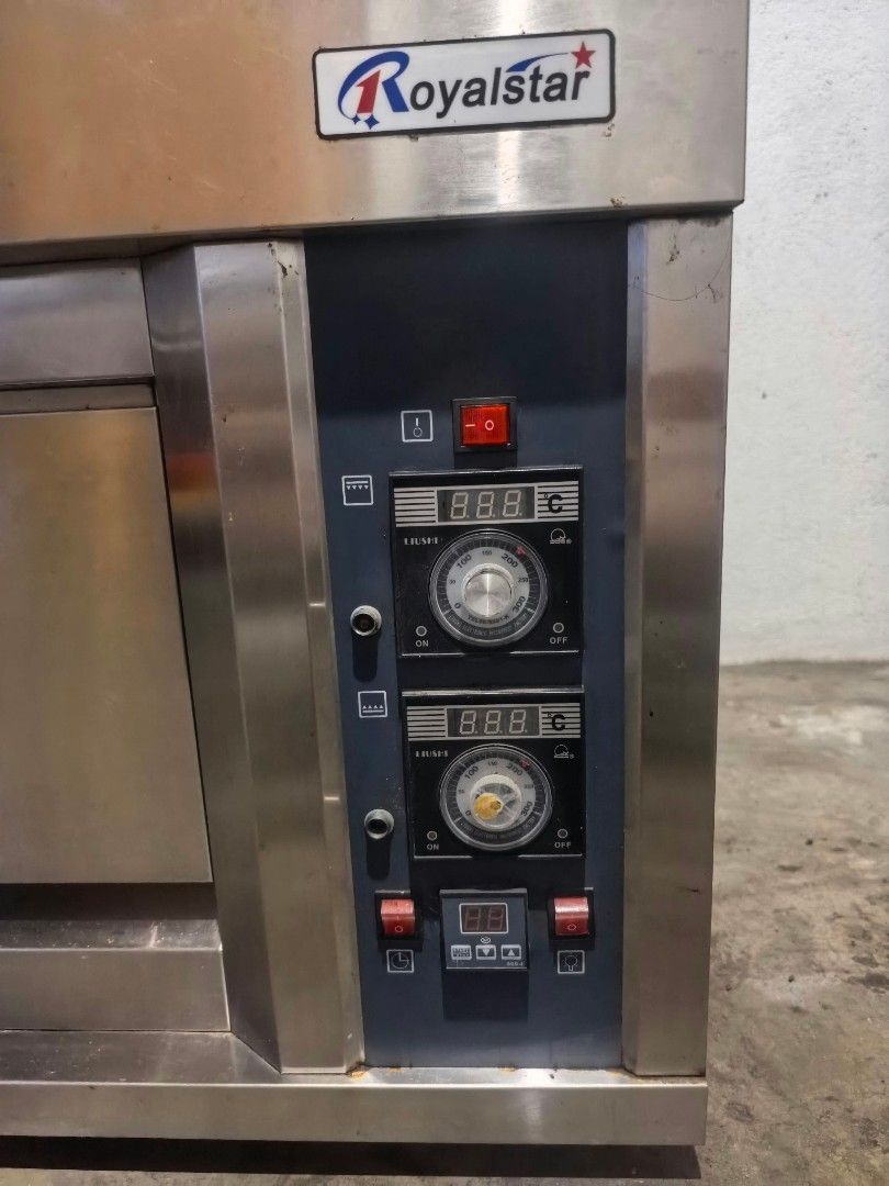 Royalstar Commercial Deck Oven (Category: Ovens & Toasters) located in Manila. Submitted by rpaul88 (Listing ID 1465709514, Image 2). Description: - Brand: Royalstar commercial oven - Material: Durable stainless steel finish - Controls: Digital temperature controls with dual heating dials - Features: Drop-down door with viewing window, side ventilation panels, and exhaust port - Best for: Bakeries, restaurants, and heavy-duty commercial use - Del