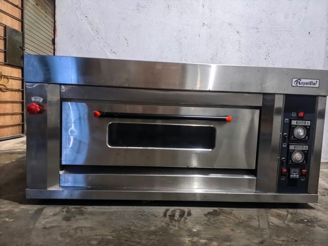 Royalstar Commercial Deck Oven (Category: Ovens & Toasters) located in Manila. Submitted by rpaul88 (Listing ID 1465709514, Image 1). Description: - Brand: Royalstar commercial oven - Material: Durable stainless steel finish - Controls: Digital temperature controls with dual heating dials - Features: Drop-down door with viewing window, side ventilation panels, and exhaust port - Best for: Bakeries, restaurants, and heavy-duty commercial use - Del
