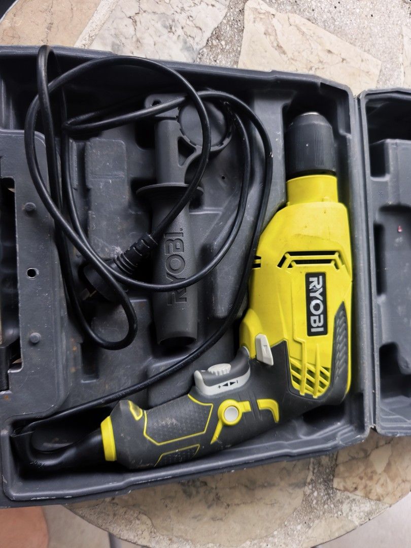 Ryobi Impact Drill with Case (Category: Construction Tools & Equipment) located in Tarlac. Submitted by ibrahimharb81 (Listing ID 1465721313, Image 2). Description: - Authentic Ryobi corded drill in a striking yellow and black colorway - Includes heavy-duty molded plastic carry case for easy storage and portability - Comes complete with a side handle for better control and stability - Textured grips designed for a secure, anti-slip hold during us