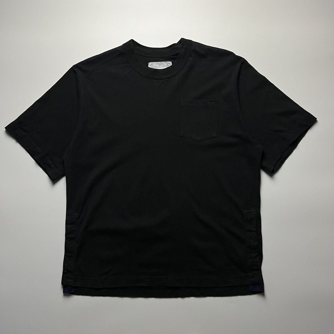 SACAI Side Snap Button Pocket T-Shirt (Category: Tshirts & Polo Shirts ) located in Manila. Submitted by streetsavvy (Listing ID 1465665992, Image 1). Description: SACAI Side Snap Button Pocket T-Shirt Size: 1 Width: 23” Length: 28.5” Shoulder: 19” Sleeve Length: 10” Hem: 22.5” Measured in Inches Condition: Excellent condition Flaw: None Made in Japan 100% Cotton.