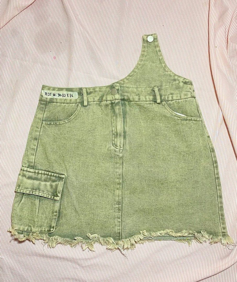 Sage Green Denim One-Shoulder Cargo Mini Skirt (Category: Skirts) located in Manila. Submitted by lucky_jinky (Listing ID 1465629532, Image 1). Description: Code:A25 W:30-32 L:16 ₱100 - Style: Y2K street style sage green denim skirt - Design: Unique one-shoulder strap, acid wash finish, and functional side cargo pocket - Details: Raw frayed hem, button closure, and belt loops - Size: Waist 30-32, Length 16.