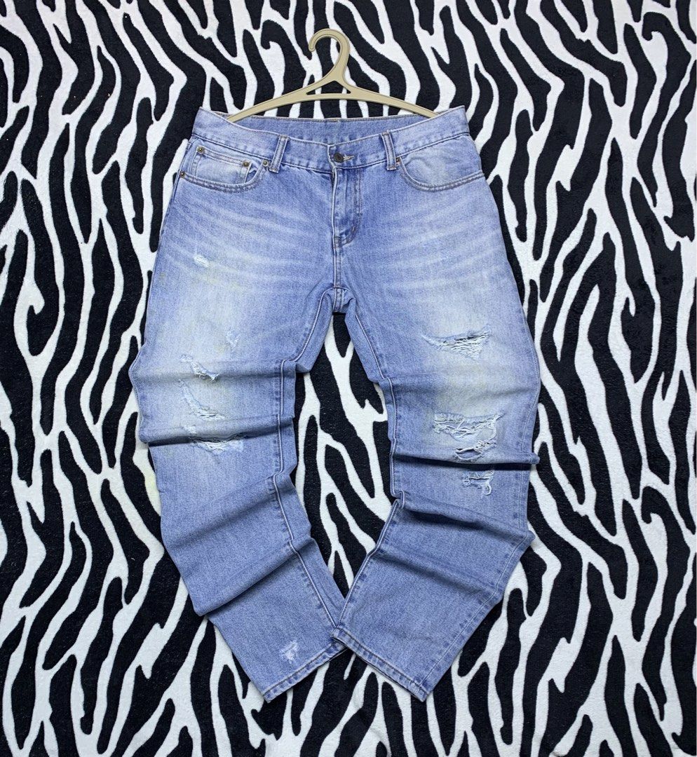 SAINT LAURENT PARIS TATTERED JEANS (Category: Jeans) located in Cagayan de Oro. Submitted by yooow.c (Listing ID 1465605324, Image 1). Description: W: 34 L: 41.5 THIGH: 12 HEM: 6.5 - good condition - have minor removable/washable yellow stain - tattered design - hard denim.