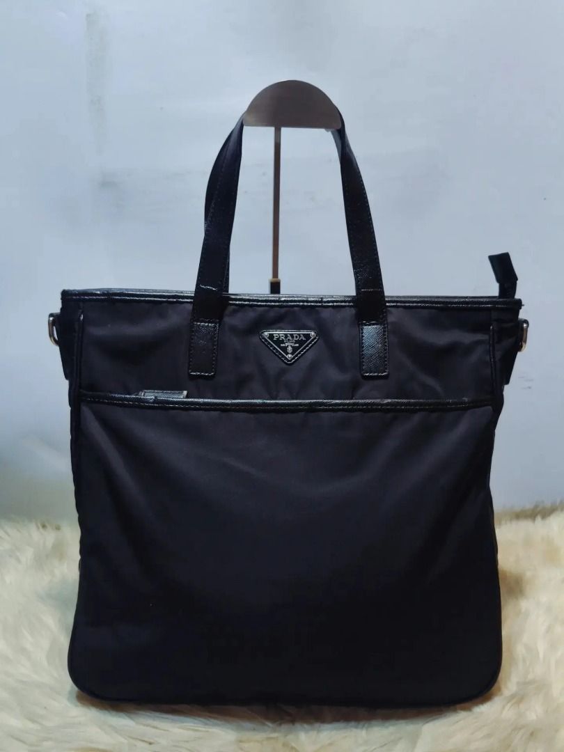 Sale! PRADA Bag (Category: Shoulder Bags) located in Cabuyao City. Submitted by your____lux____shop (Listing ID 1465684366, Image 1). Description: Sale❗️Sale❗️Sale❗️ ₱ 2,899 PRADA Preloved Black LAMPO under zip Large - XL Nylon & leather trim 📌First to pay.