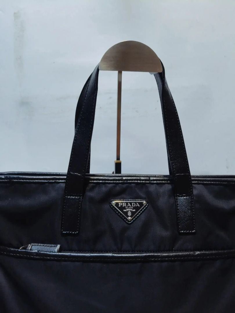 Sale! PRADA Bag (Category: Shoulder Bags) located in Cabuyao City. Submitted by your____lux____shop (Listing ID 1465684366, Image 3). Description: Sale❗️Sale❗️Sale❗️ ₱ 2,899 PRADA Preloved Black LAMPO under zip Large - XL Nylon & leather trim 📌First to pay.