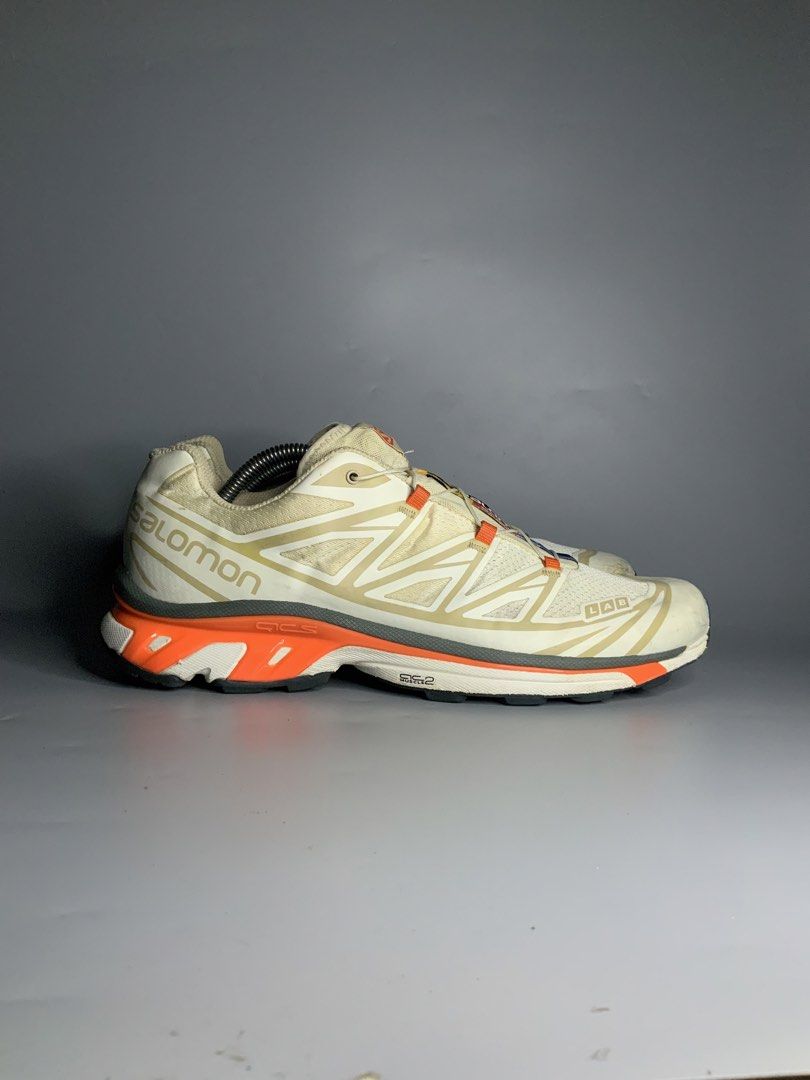 Salomon XT-6 (Category: Sneakers) located in Cavite. Submitted by kalye_footwear (Listing ID 1465713571, Image 2). Description: - Brand: SalomonXT-6 - Model: S-Lab XT-6 Soft Ground - Size: Us 10.5 , Euro 44.5 , Cm 28.5 - Colorway: White and off-white upper with vibrant orange, grey, blue, and yellow accents - Features: Quicklace system and S-Lab XT-6 heel branding - Condition: Excellent Lugs condition, minor scuffs and marks on the toe caps .